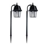 Black solar-powered garden light shepherd with clear glass panels and classic ornate design on shepherd hook
