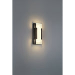Modern wall-mounted light fixture on a gray wall