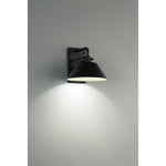 Black wall-mounted light fixture on a gray background