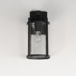 Black outdoor wall light fixture with clear glass cover on a white background