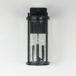 Black outdoor wall light fixture with clear glass cover on a white background