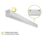 A white linear LED light fixture shown at an angle on a white background, with a circular inset highlighting the back contact points, a yellow badge indicating 150 lm/W efficiency, and text stating 'POWER ADJUSTABLE & COLOR SELECTABLE'.