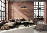 Modern living room with brick wall and large windows