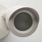 Close-up of a white ceiling light fixture on a white background