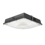 Black led slim canopy light with clear diffused lens and heat-dissipating ridged housing for industrial use