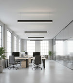 Black 4 ft led direct indirect suspended linear fixture with selectable wattage and cct in a modern office space