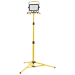 A yellow portable LED work light on an adjustable three-legged stand, shown against a plain white background.