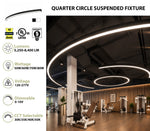 Quarter circle suspended LED light fixture shown installed in a modern gym interior, with product specs and certification icons displayed on the left side of the image.