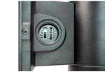 Close-up detail of a cylindrical wall light focusing on the objective lens cover adjustment mechanism, showing a textured dark gray metal body and a silver adjustment dial.