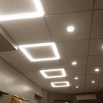 Modern recessed ceiling lights featuring 2x2 led grid frame panels and circular spotlights with selectable wattage and cct
