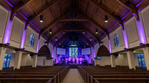 LED architectural cylinder lights in a historic church sanctuary with vaulted wood ceiling
