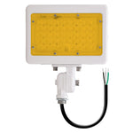 White rectangular led mini flood with yellow translucent panel and exposed wiring featuring integrated photocell