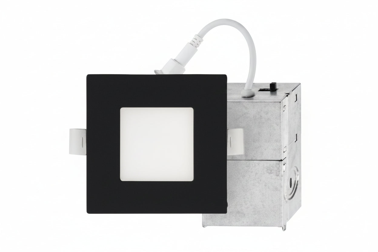 Square light fixture with black frame and white square in center on a white background