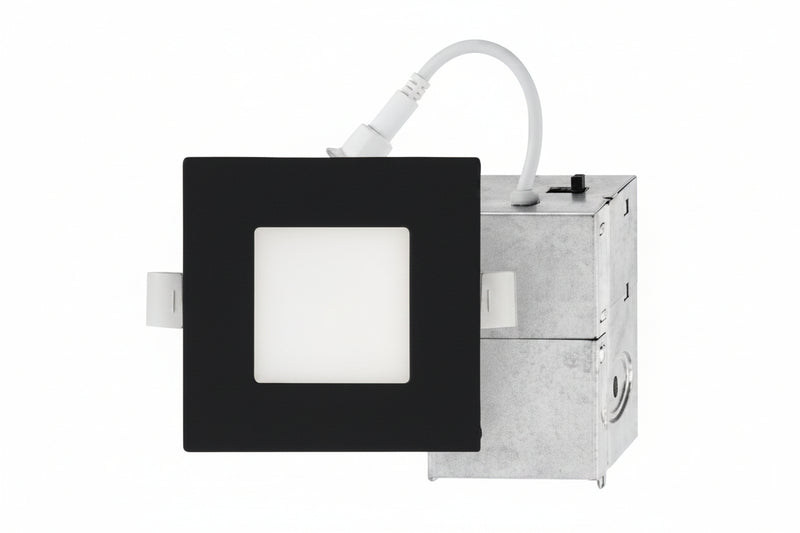 Square light fixture with black frame and white square in center on a white background