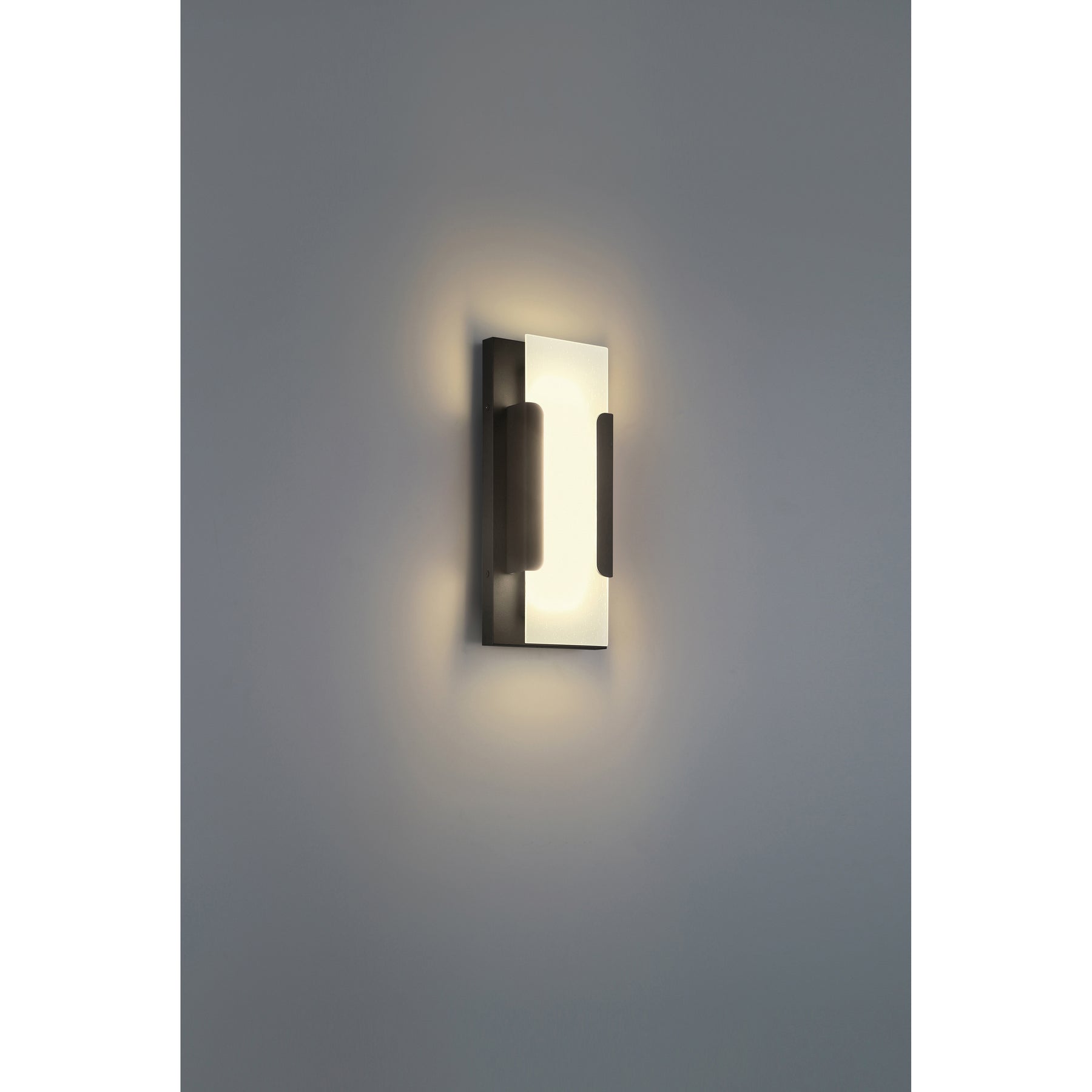 Modern wall-mounted light fixture on a gray wall