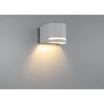 Satin wall-mounted light fixture on a gray background