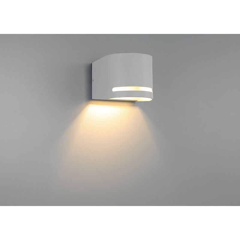 Satin wall-mounted light fixture on a gray background