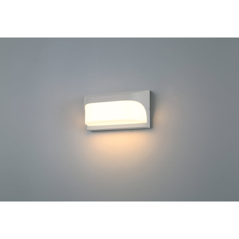 Modern wall-mounted light fixture on a gray background