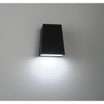 Black rectangular wall light fixture on a gray background