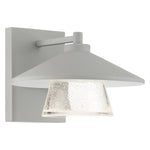 Satin outdoor wall light fixture with clear glass shade on a white background