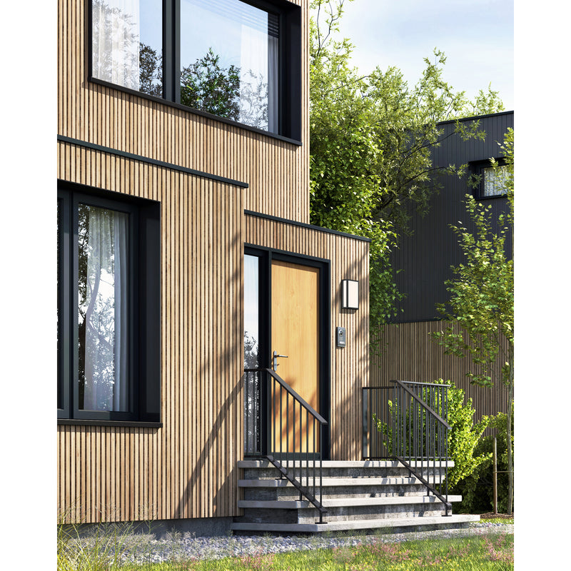 Modern house exterior with wooden facade and glass windows