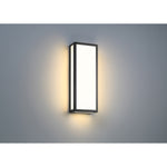 Modern wall-mounted light fixture on a gray background