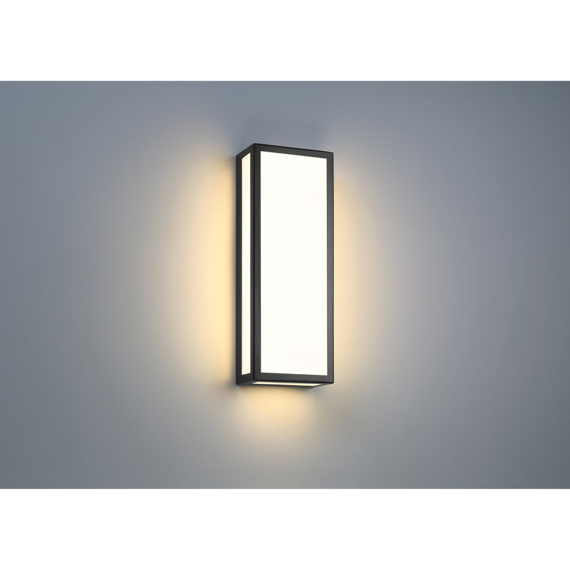 Modern wall-mounted light fixture on a gray background