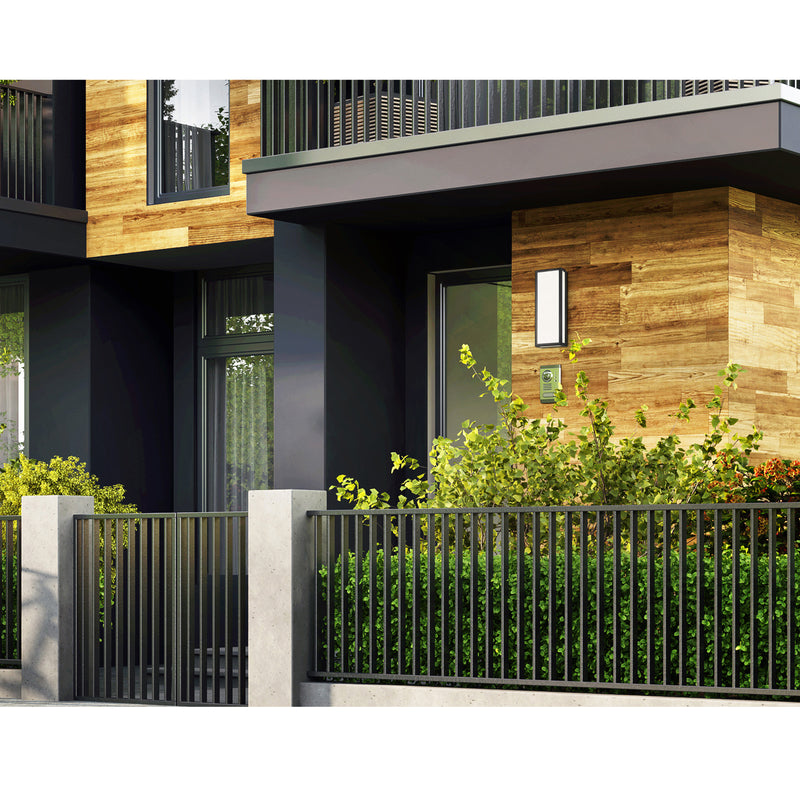 Modern house exterior with wooden facade, glass windows, and greenery.