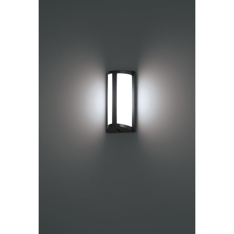 Wall-mounted outdoor light fixture on a gray wall