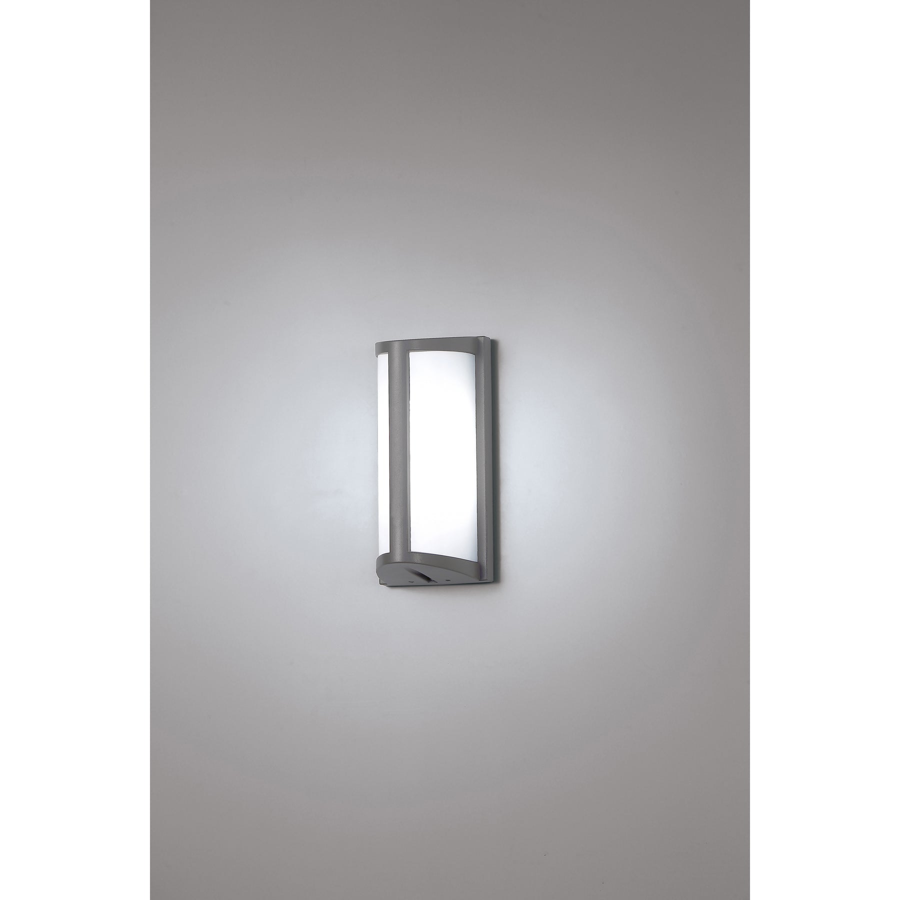 Modern outdoor wall light fixture on a gray background