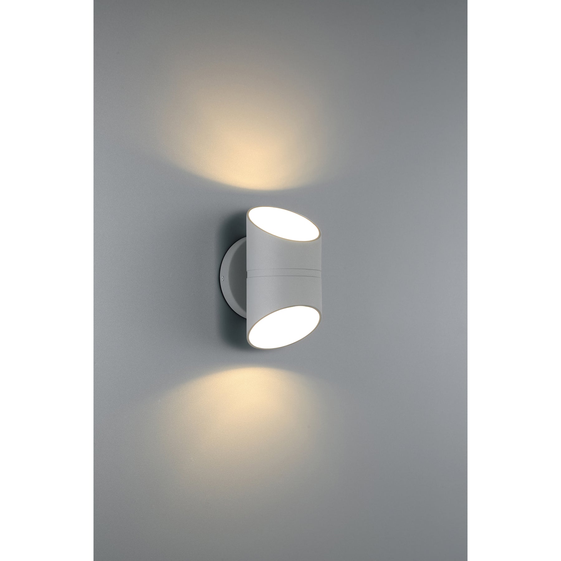 Modern outdoor wall light fixture on a gray background