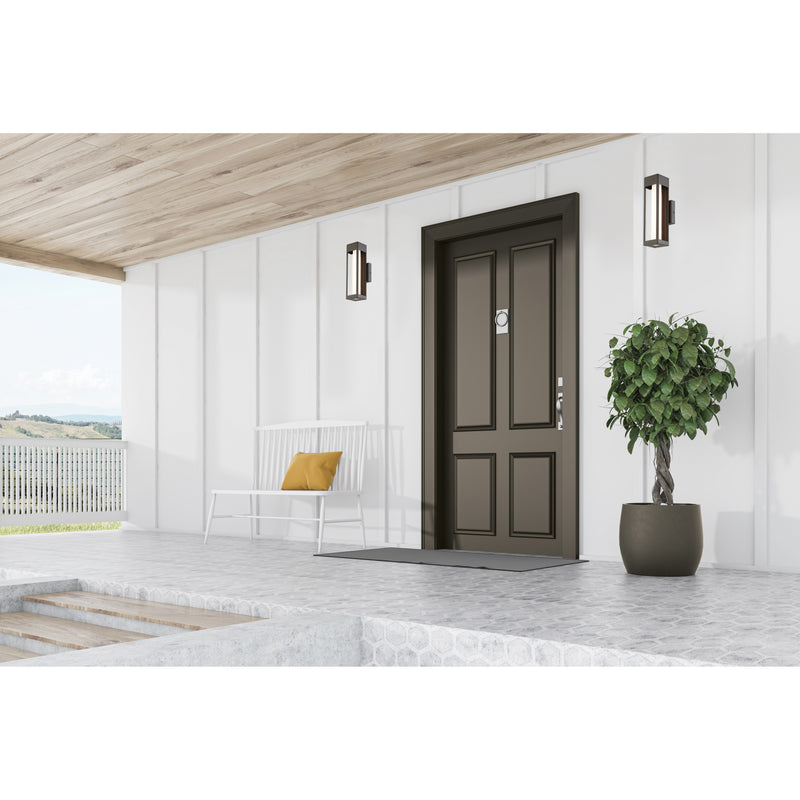 Modern front door with a plant and bench on a white wall