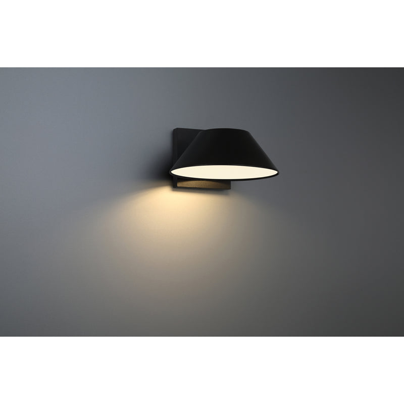 Black wall-mounted outdoor light fixture on a gray background