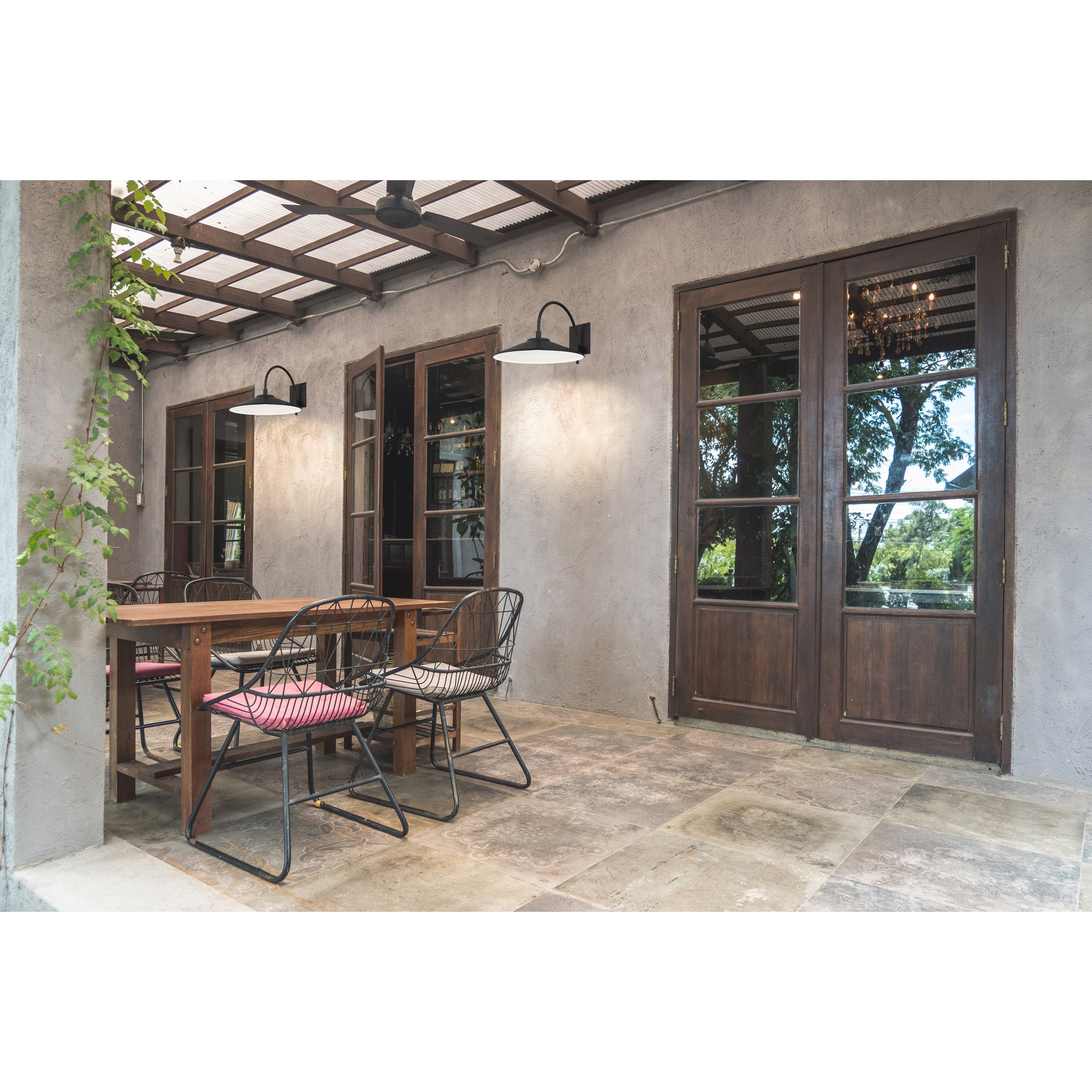 Dining area with wooden table and chairs in a rustic setting