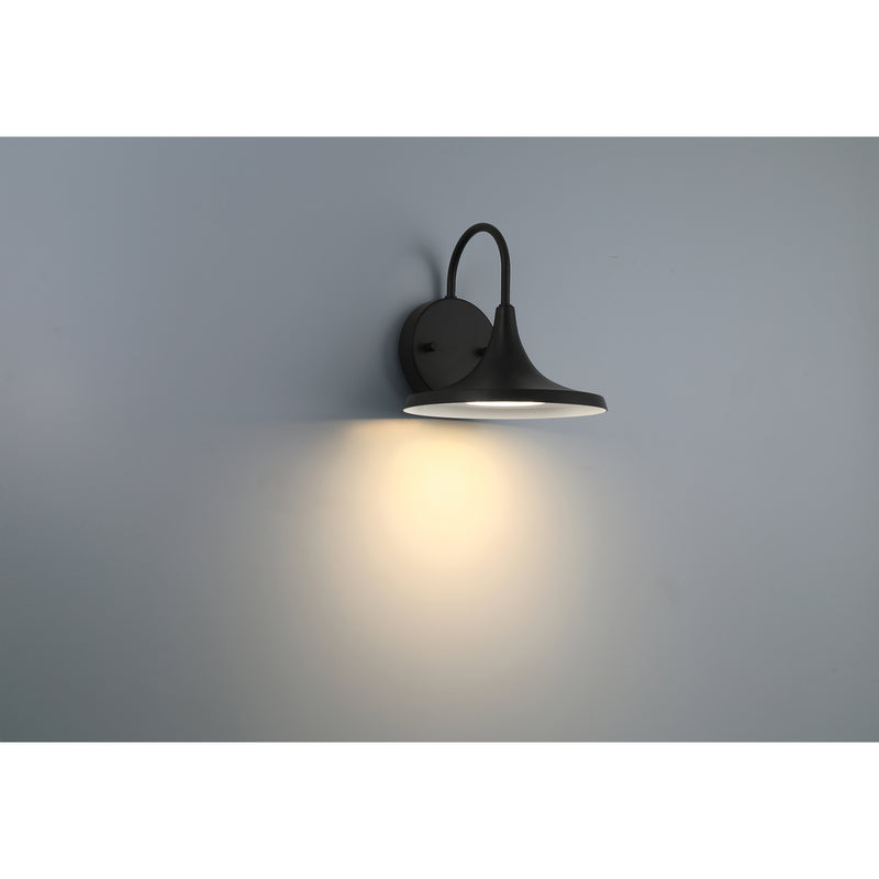 Black wall-mounted light fixture on a gray wall