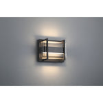 Modern wall-mounted light fixture on a gray wall