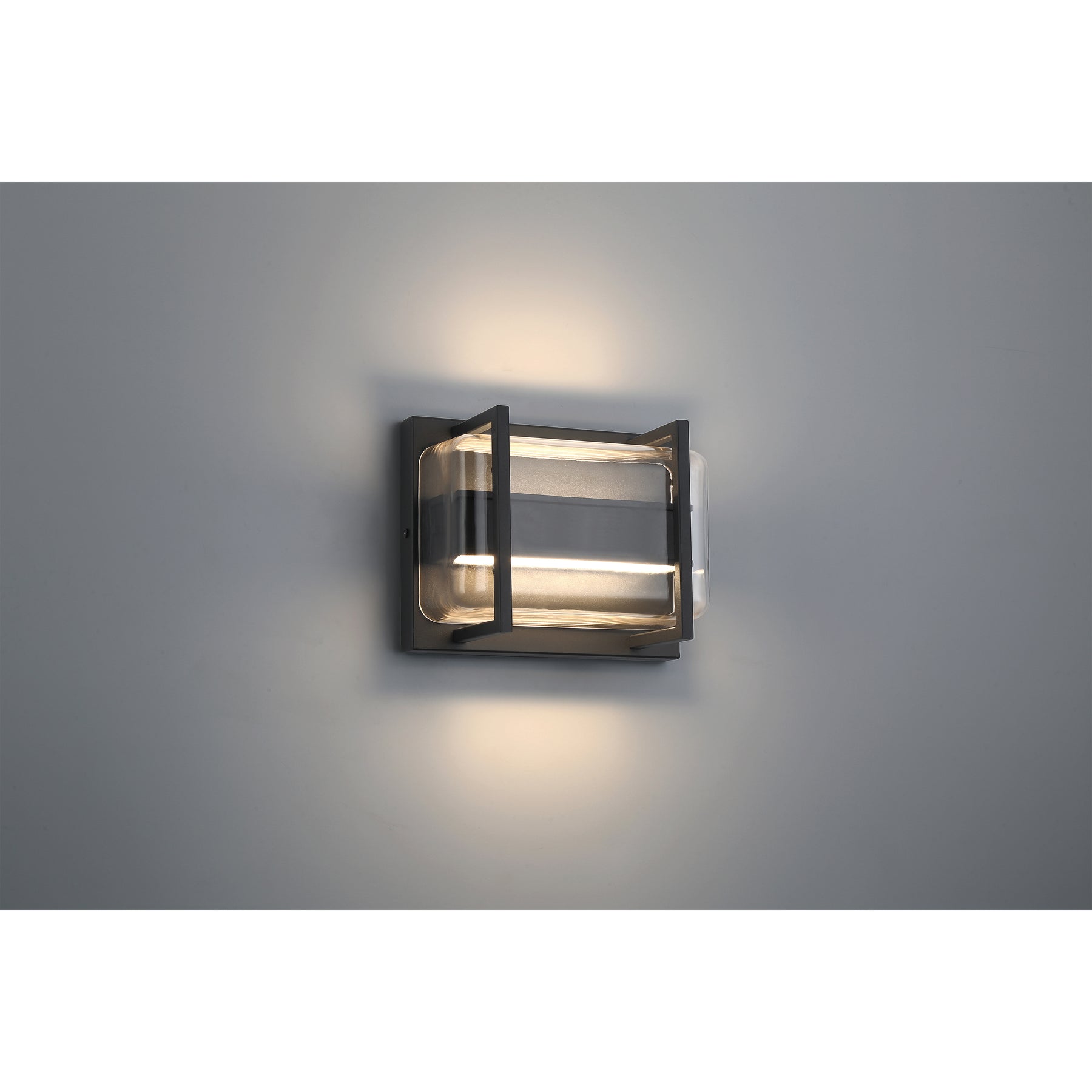 Modern wall-mounted light fixture on a gray wall