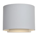 White cylindrical light fixture on a white background