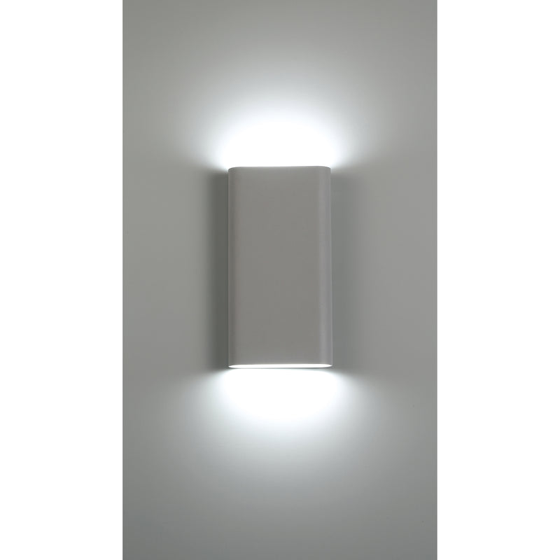 Modern wall-mounted light fixture on a gray wall