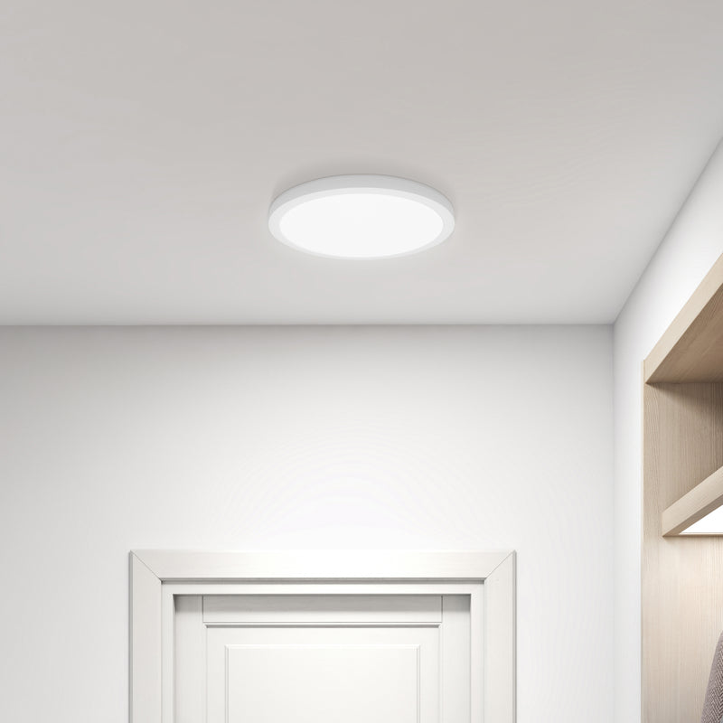 Ceiling light fixture in a room with white walls and a door.