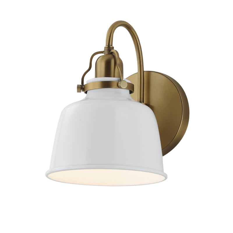 A modern wall sconce light fixture featuring a white bell-shaped glass shade and an antique brass curved arm and round wall mount, shown against a plain white background.