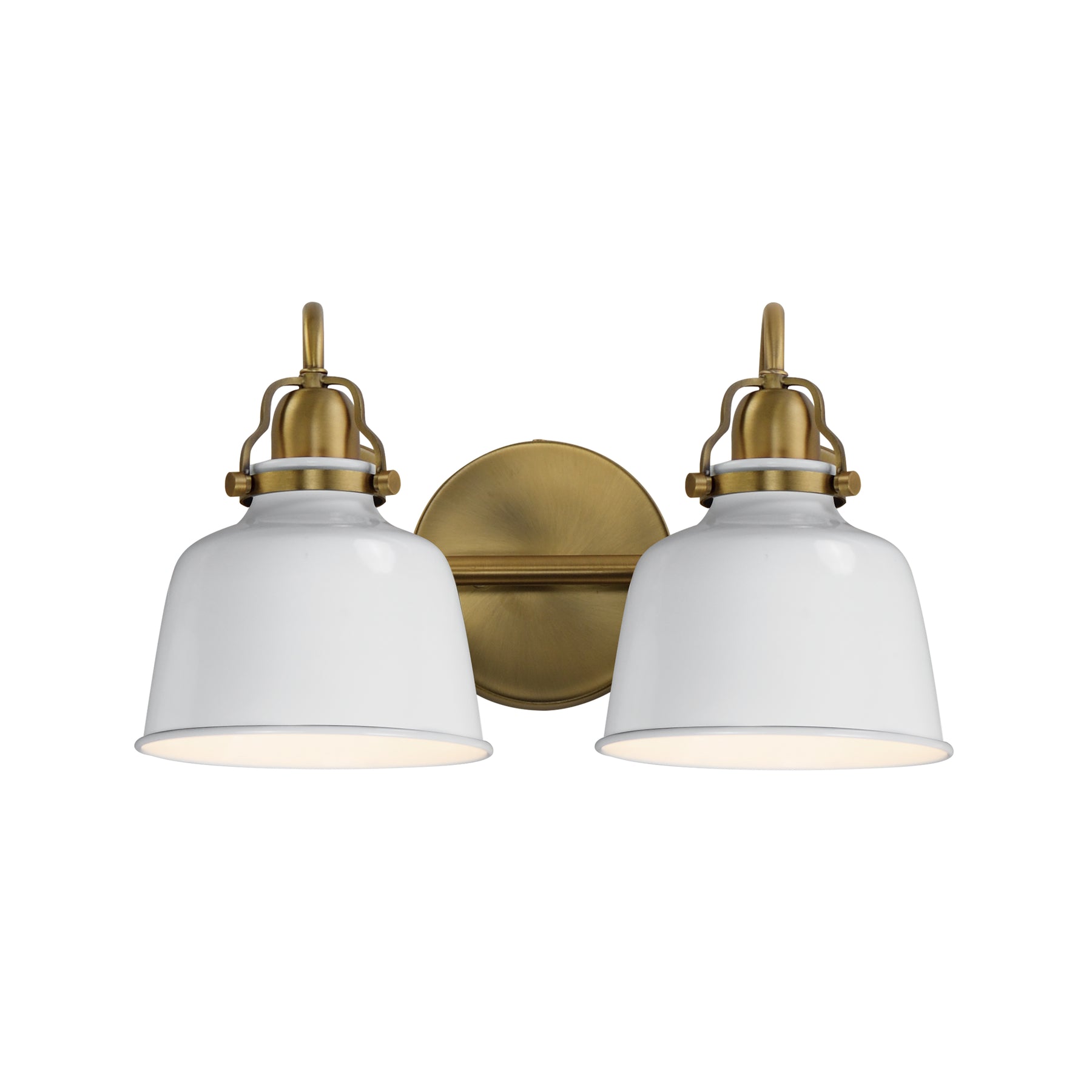 A two-light wall sconce with white bell-shaped glass shades and an antique brass backplate and hardware, shown against a plain white background.