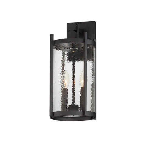 Black outdoor wall light fixture with clear glass on a white background