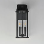 Black outdoor wall light fixture on a gray background