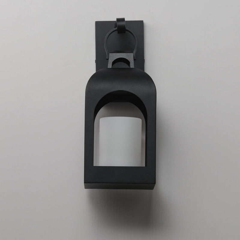 A matte black outdoor wall sconce with a square frame and arched opening, mounted on a light gray wall.