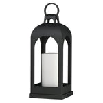 A black metal lantern with a top handle and a white pillar candle inside, shown on a plain white background.