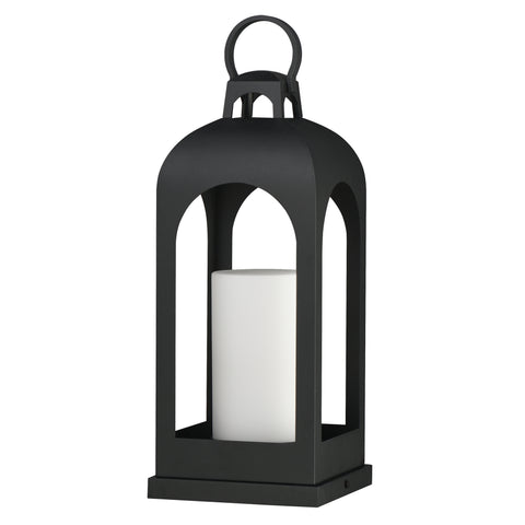 A black metal lantern with a top handle and a white pillar candle inside, shown on a plain white background.