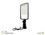 A black rectangular LED floodlight with a mounting bracket and a coiled 2-foot power cord, shown on a white background with text indicating '2FT POWER CORD' and 'BLACK'.