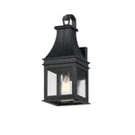 Black outdoor wall lantern with clear glass on a white background