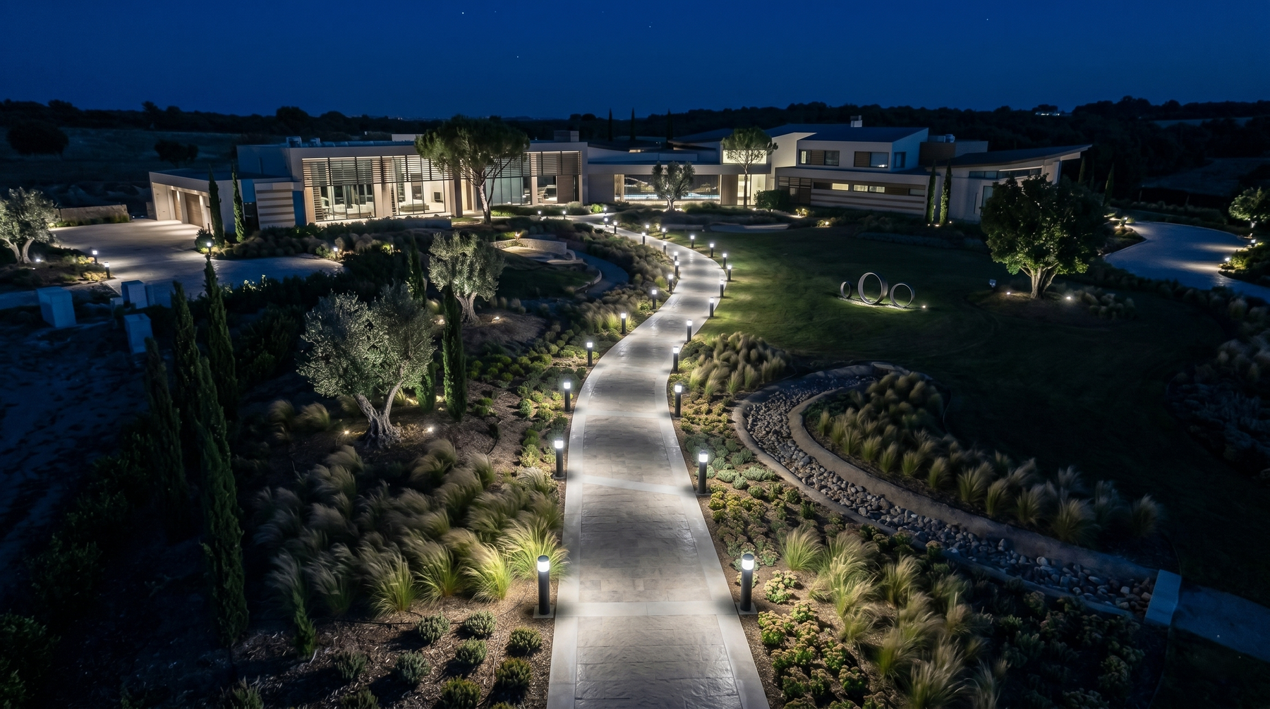 Modern minimalist mansion lit by commercial LED bollard light with cone reflector and selectable CCT in black exterior